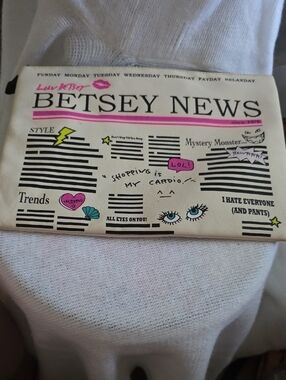 Betsey Johnson Cream Newsprint Cosmetic Pouch with Pink Accents